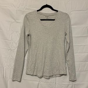 Grey and white striped long sleeve shirt.